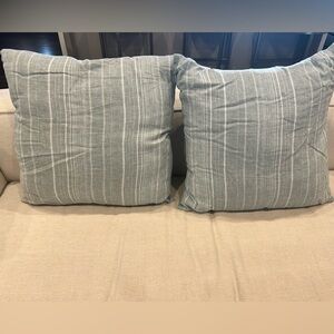 Set of light blue and white throw pillows